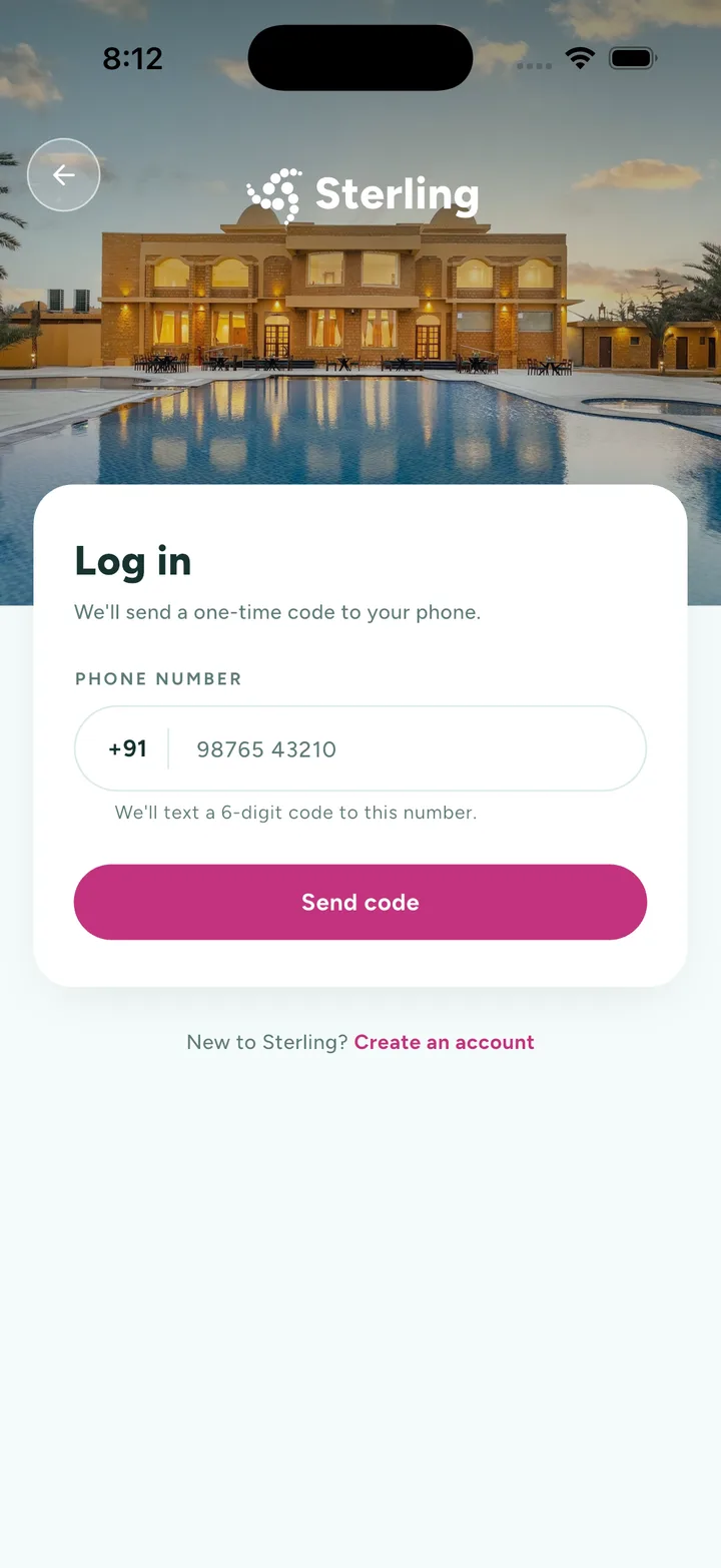 The log-in screen: a card over a resort photograph asking for a phone number behind a country-code field, with a note that a six-digit code will be texted to it.
